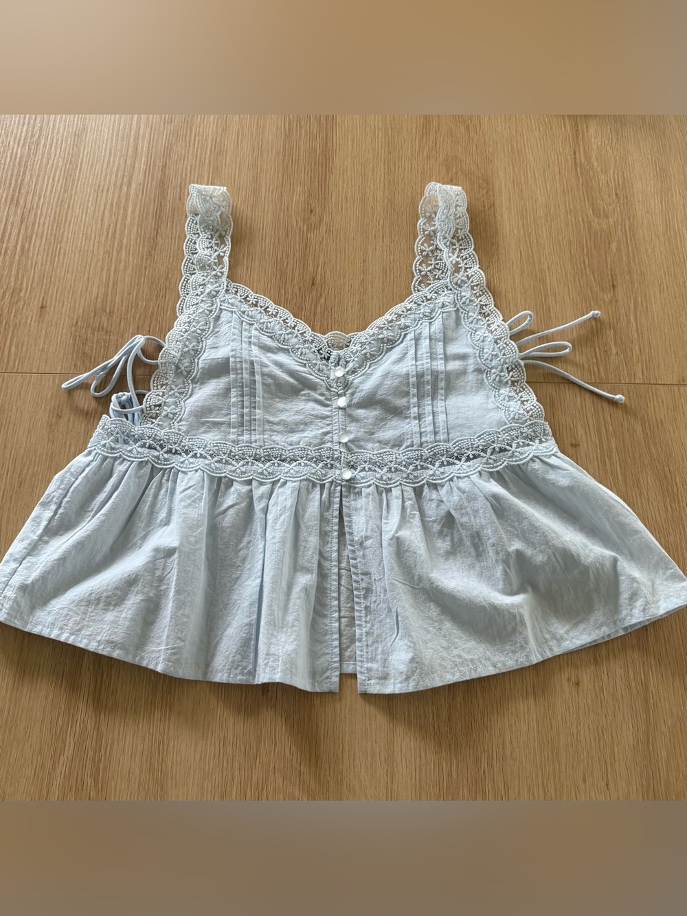 light blue sleeveless top